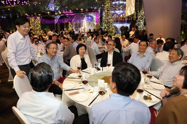 Minister Lawrence Wong mingling with guests.